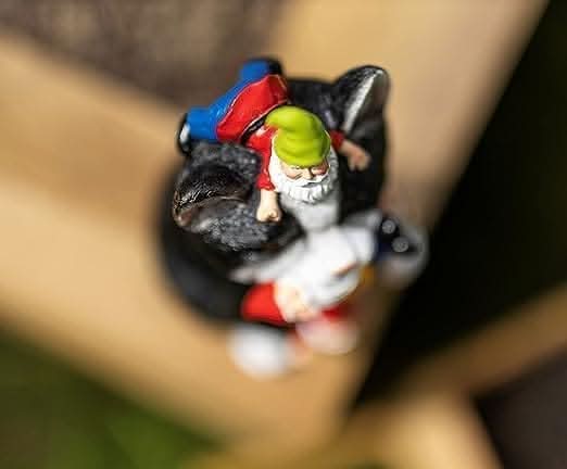 Resin Gnome Eating Colourful Cat Ornament