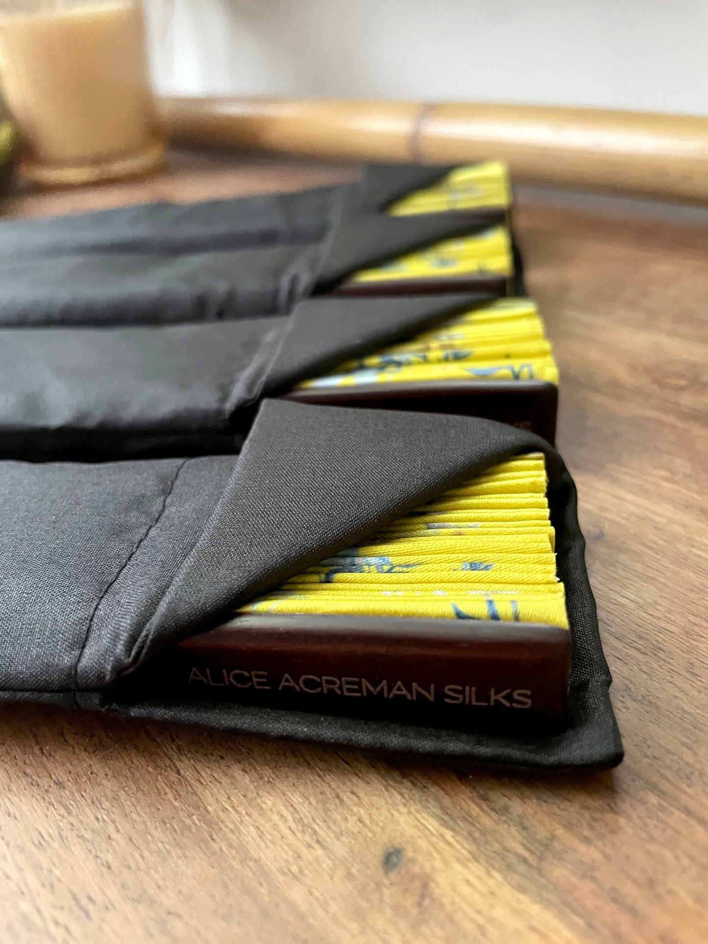 Bright yellow 'Luciferin' silk folding hand fan with flowers and mushroom painted artwork