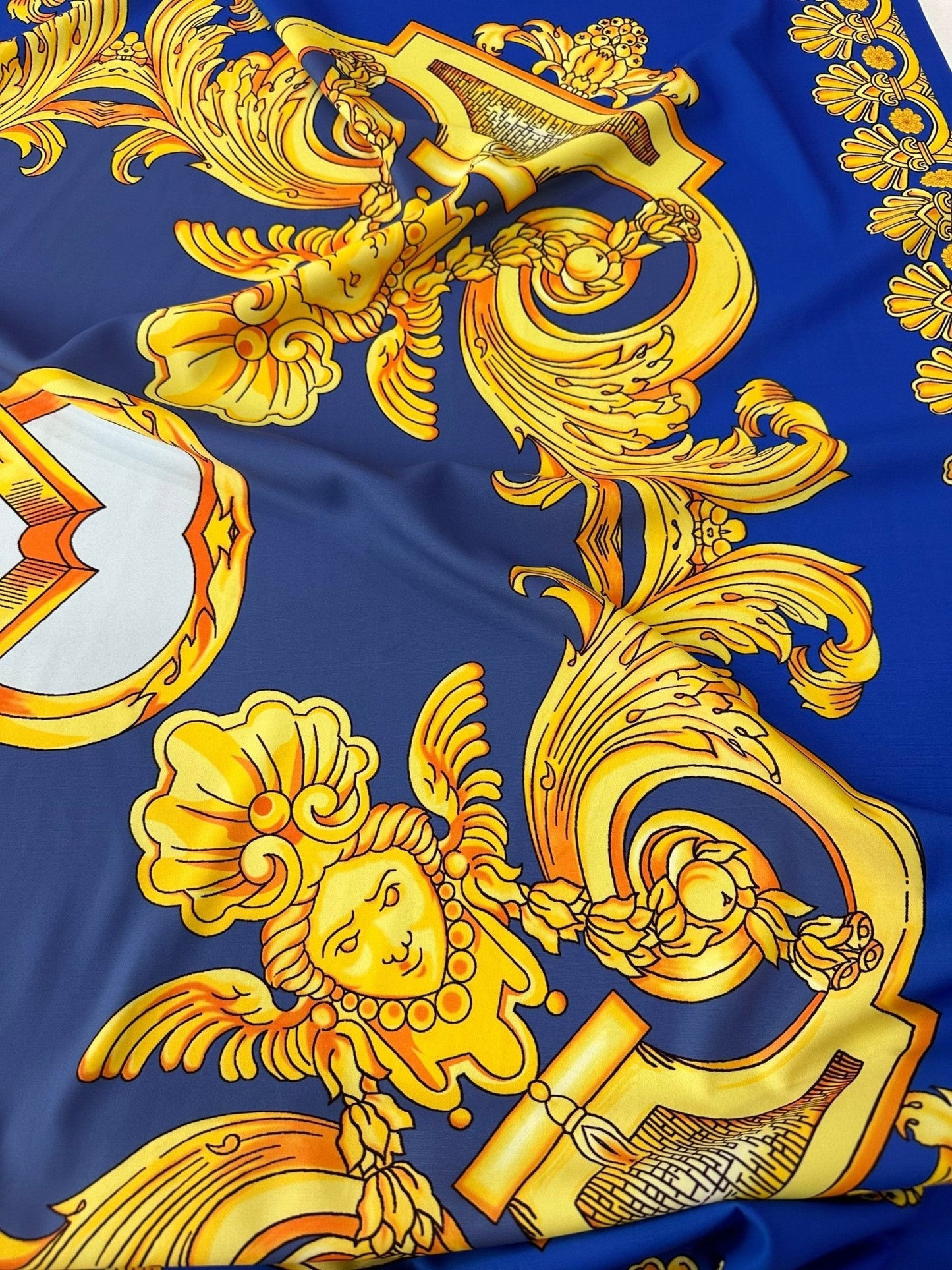 Baroque Gold Pattern Fabric on Royal Blue Background