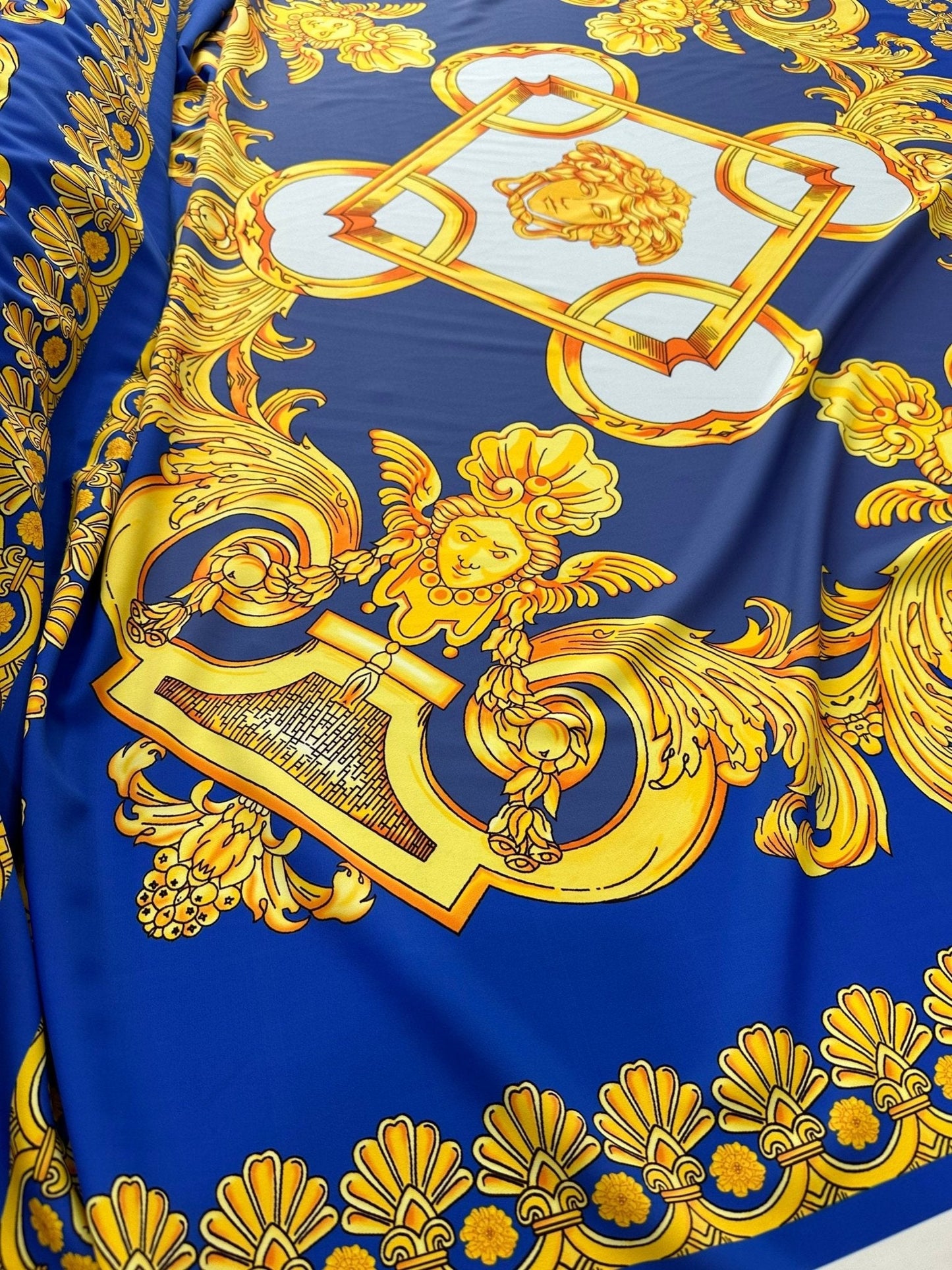 Baroque Gold Pattern Fabric on Royal Blue Background