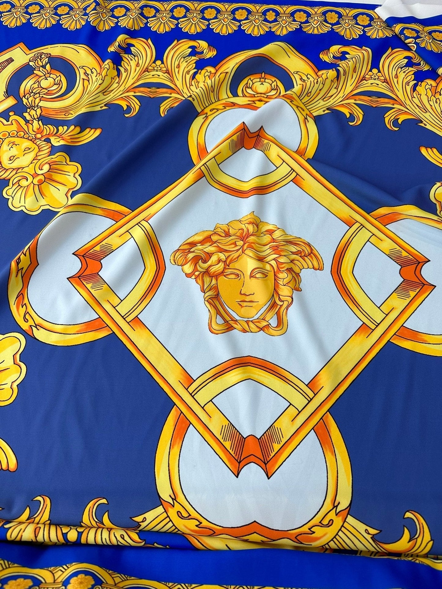 Baroque Gold Pattern Fabric on Royal Blue Background