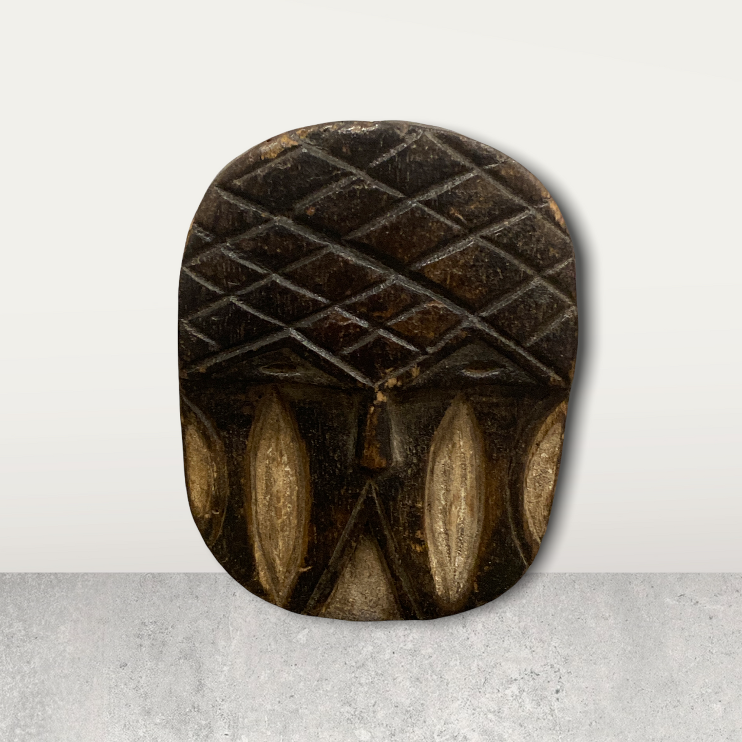 Small African mask on stand