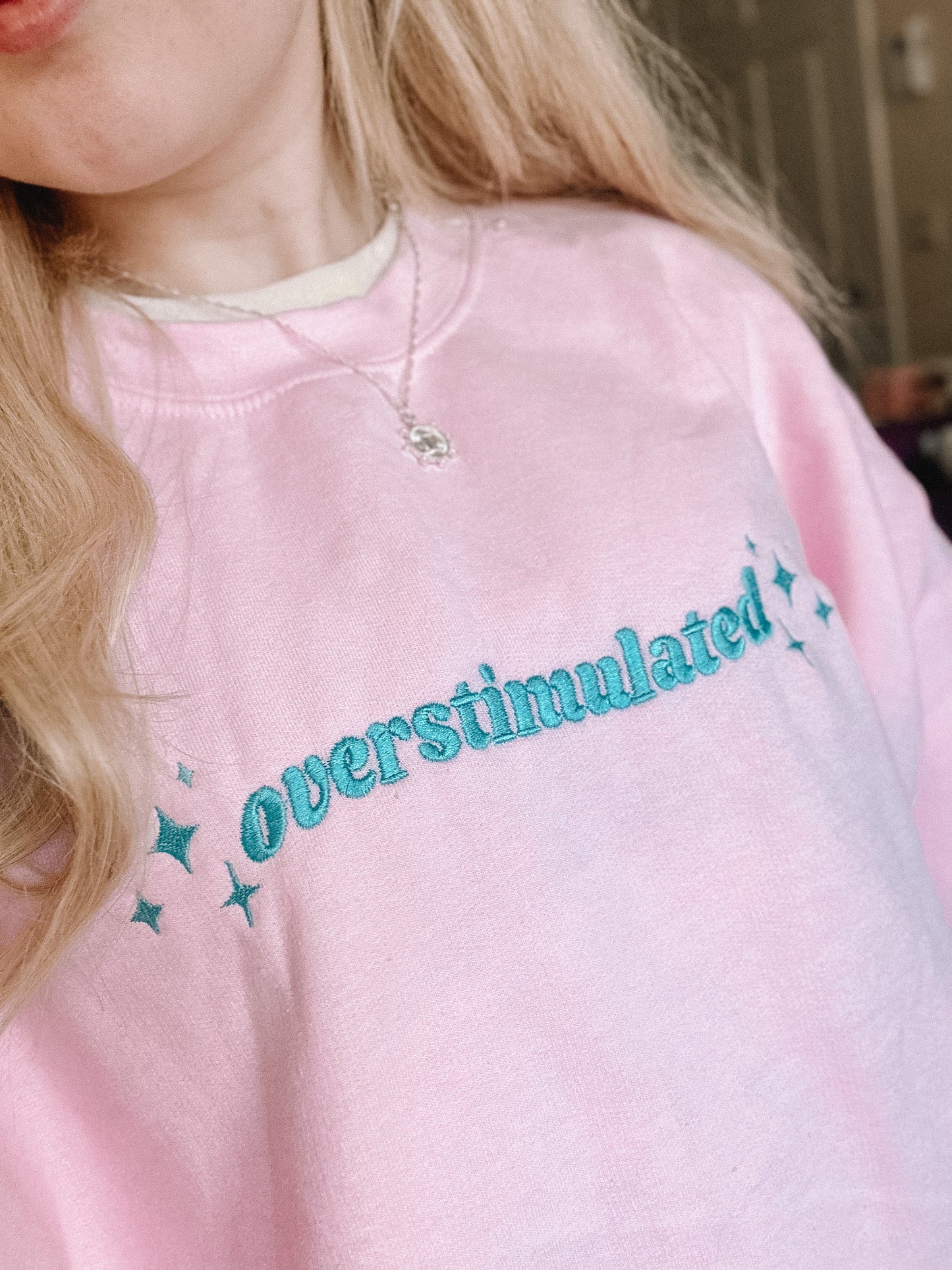 Overstimulated embroidered crewneck sweatshirt