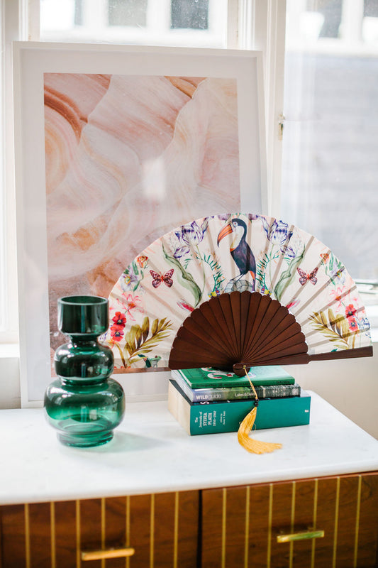 Floral Silk Fan with Toucan design and luxurious Gold tassel, part of the Mysa Collection