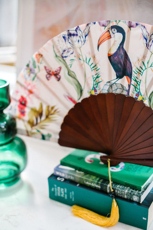 Floral Silk Fan with Toucan design and luxurious Gold tassel, part of the Mysa Collection