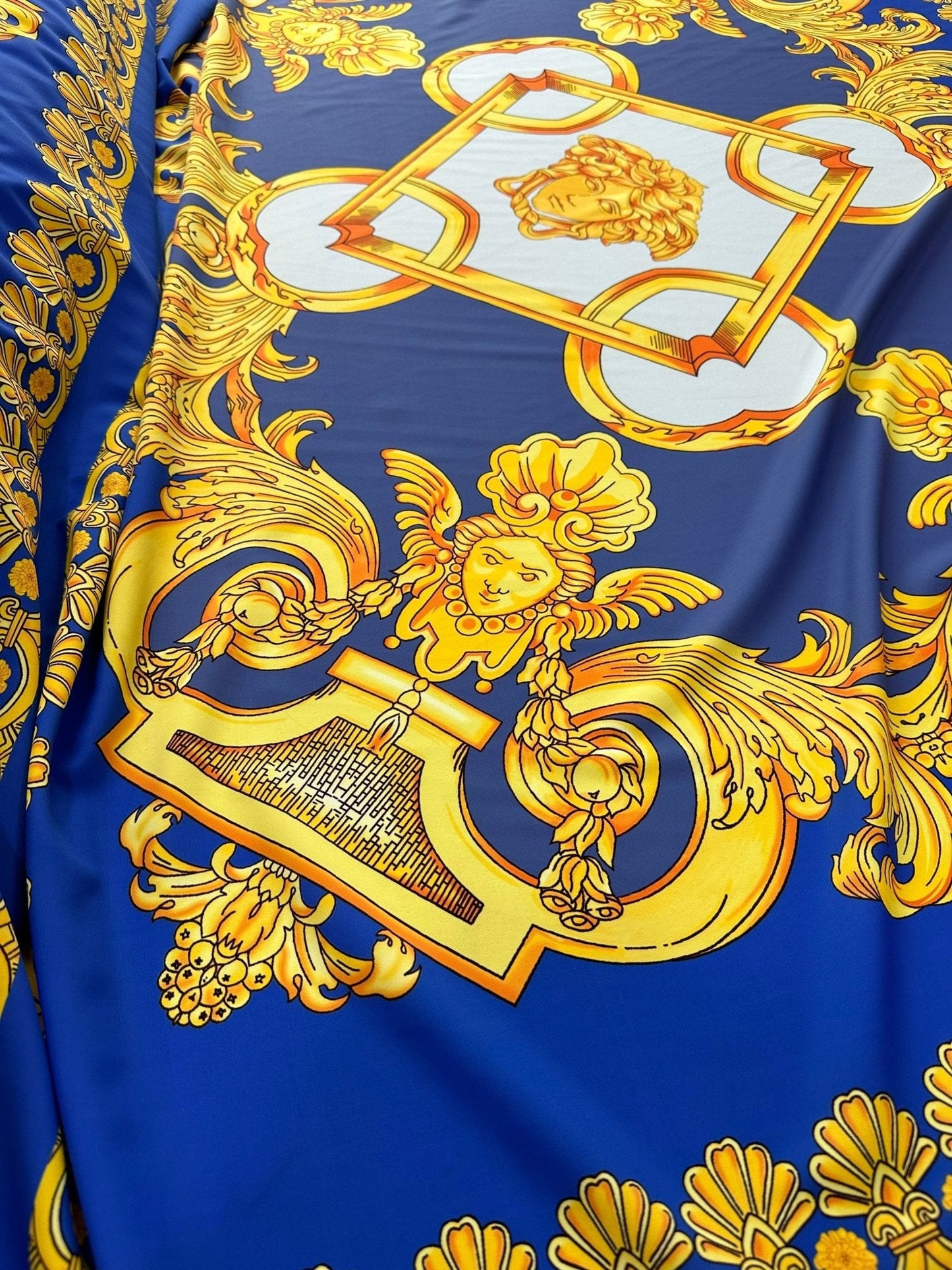 Baroque Gold Pattern Fabric on Royal Blue Background