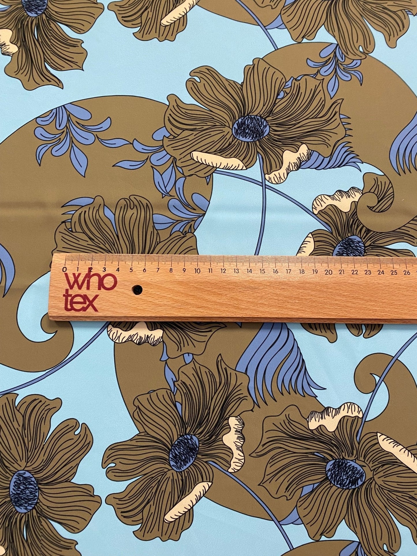 Brown Floral Print Fabric on Light Blue Background