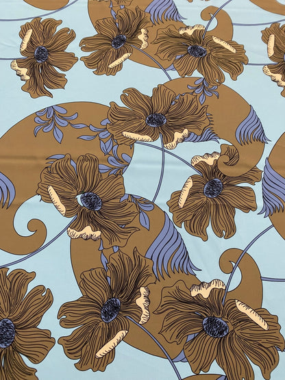 Brown Floral Print Fabric on Light Blue Background
