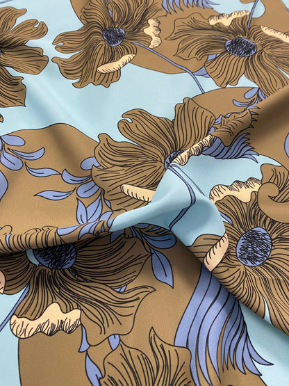 Brown Floral Print Fabric on Light Blue Background