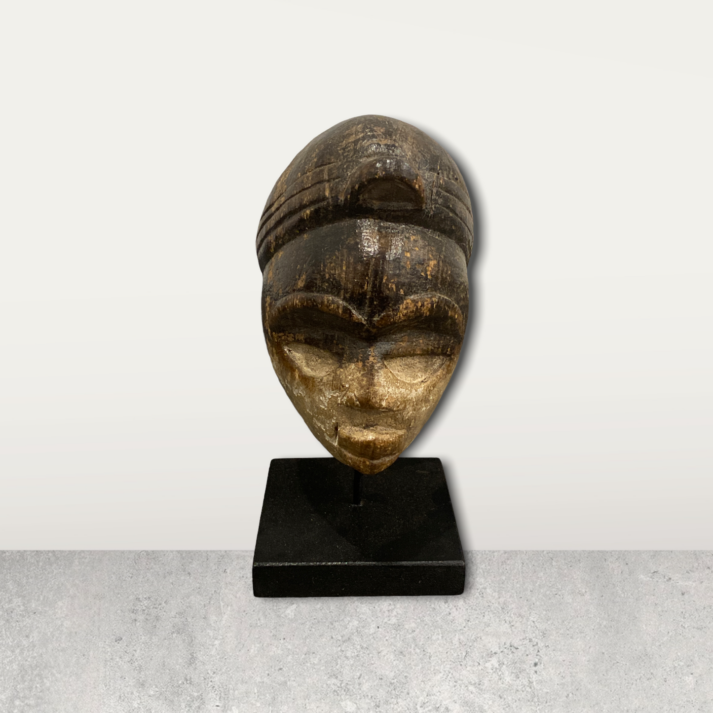 Small African mask on stand