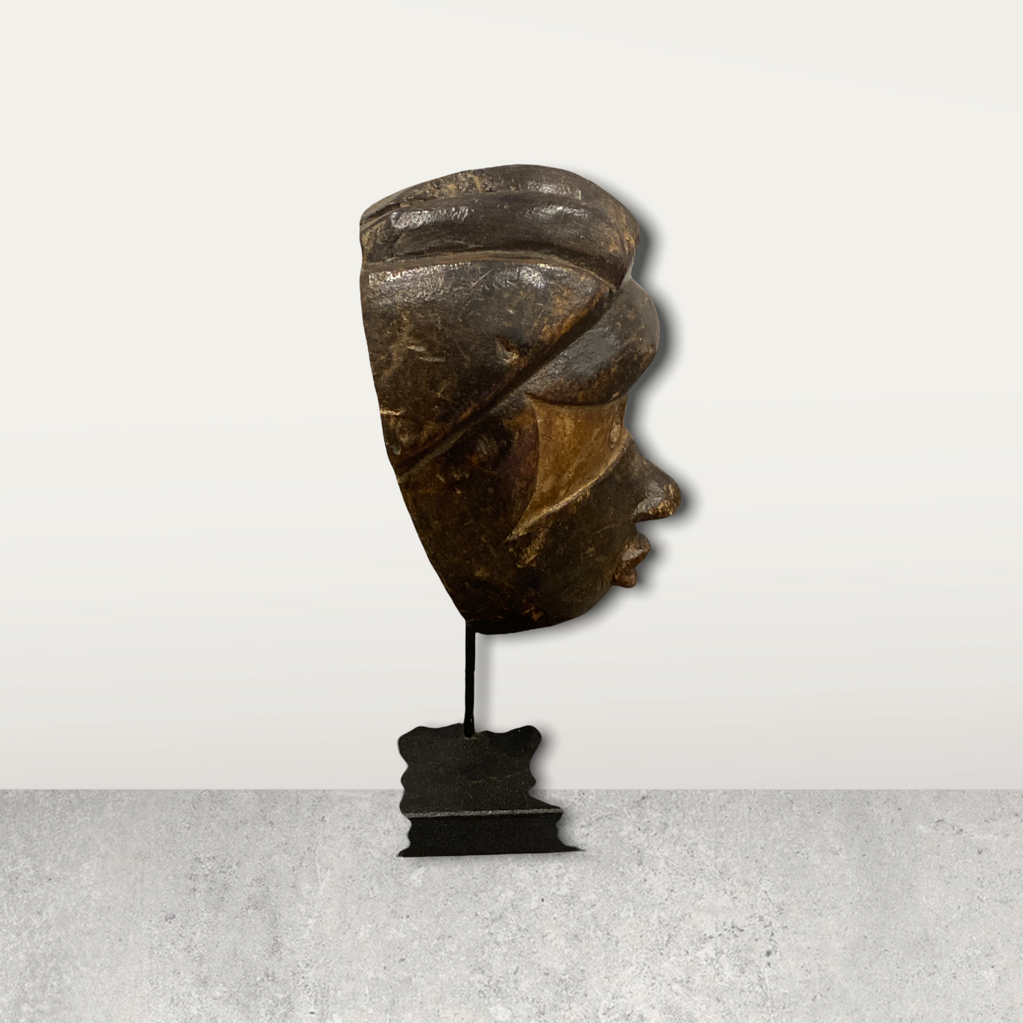 Small African mask on stands