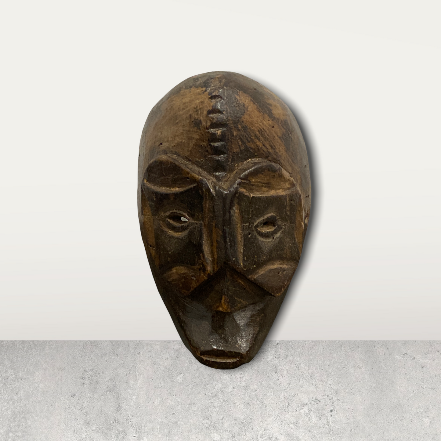 Small African mask on stand