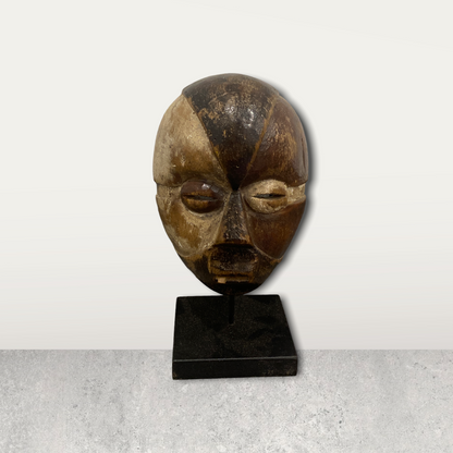 Small African masks on stands