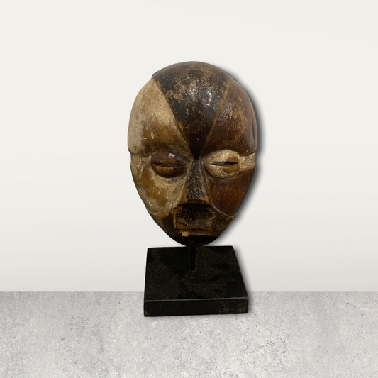 Small African masks on stands