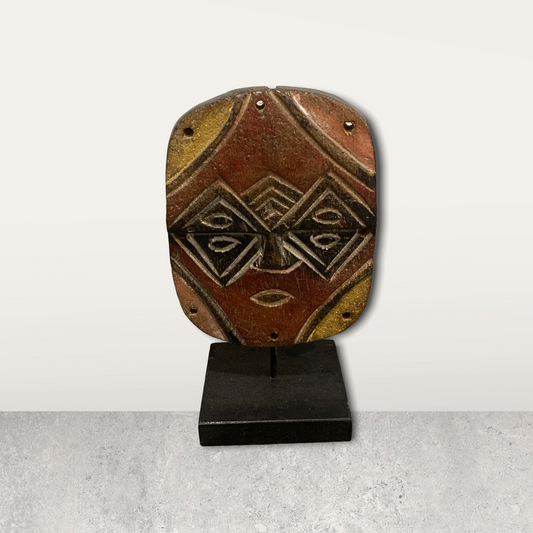 Small African mask on stand