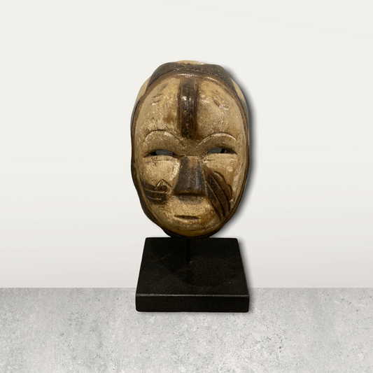 Small African mask on stand