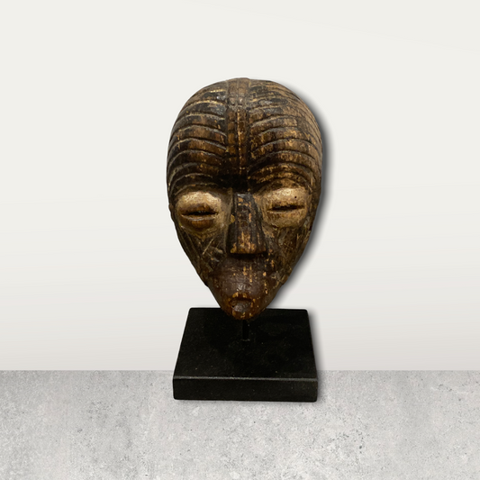 Small African mask on stand