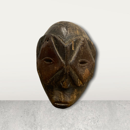 Small African mask on stand
