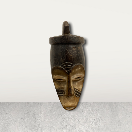Small African masks on stands