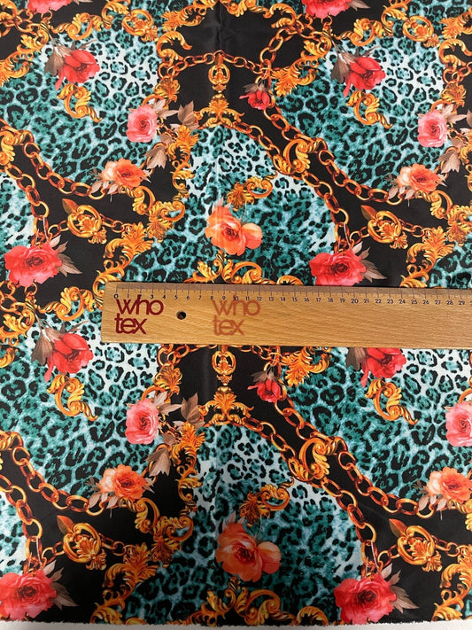 Leopard Print Fabric with Gold Chains and Floral Accentsn