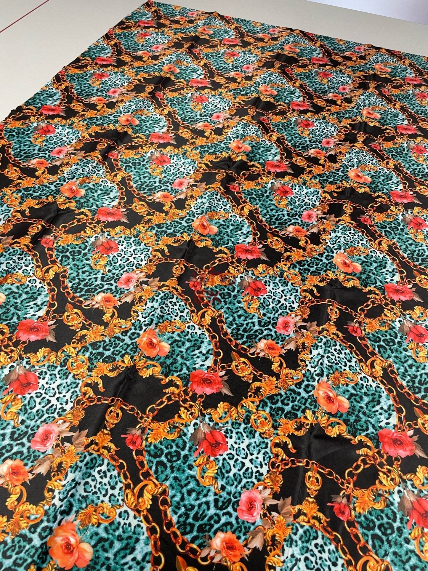 Leopard Print Fabric with Gold Chains and Floral Accentsn