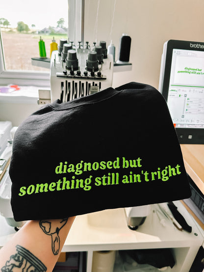 Diagnosed But Something Still Ain’t Right embroidered crewneck sweatshirt
