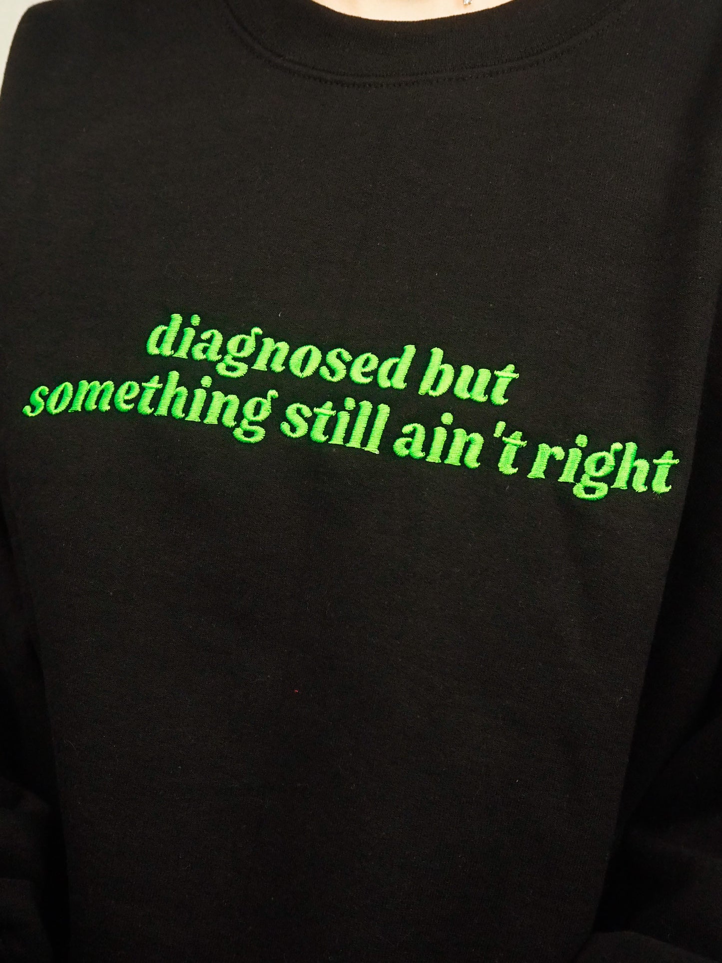 Diagnosed But Something Still Ain’t Right embroidered crewneck sweatshirt