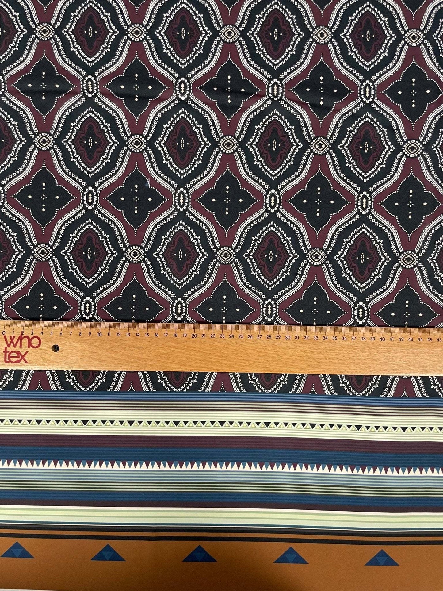 Burgundy and Black Geometric Pattern with Ethnic Striped Edge Design Fabric – Available in Satin, Crepe, Spandex & Chiffon | By Metre